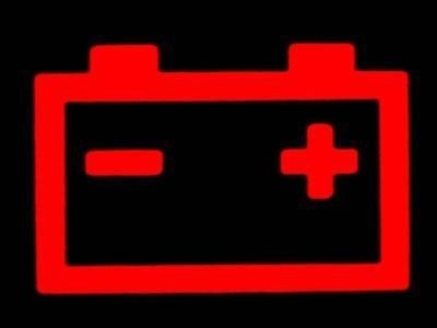 A Mini Cooper dashboard displaying the charging system warning light