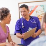 Renown Health ER nurse consults with a patient