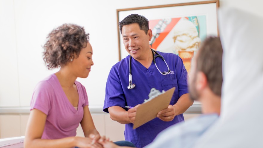 Renown Health ER nurse consults with a patient