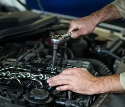 Mechanic using a multimeter to diagnose a car's electrical system in Dandenong