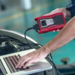 mechanic performing car diagnostic test