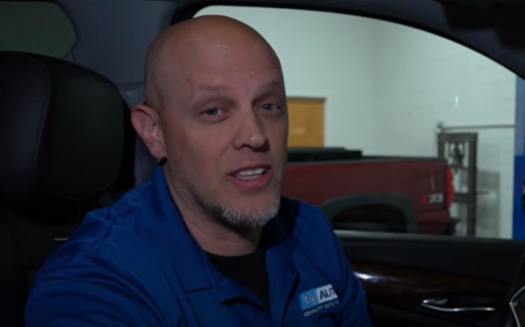 Mechanic inspecting a car's computer system