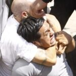 GULP! An alleged thief gets an AutoZone employee in a headlock yesterday before the tables were turned.