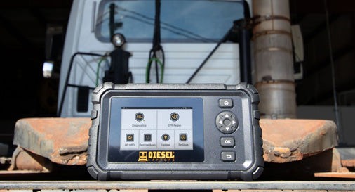 Handheld propped up on back of truck
