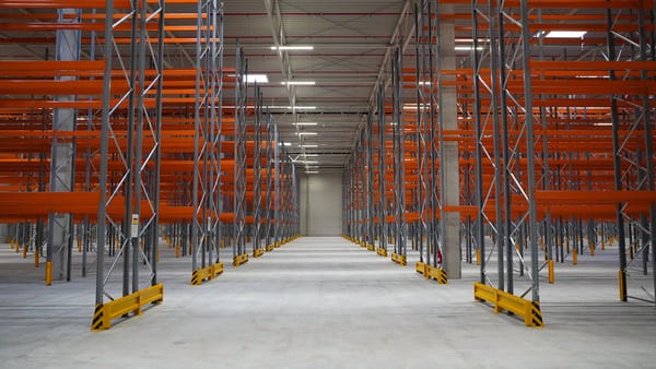 Empty warehouse with rows of unused pallet racking
