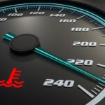 Dashboard gauge indicating normal coolant temperature range.