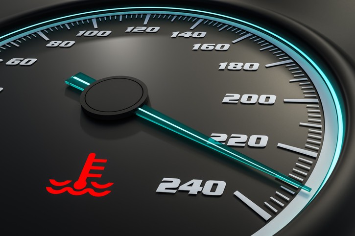 Dashboard gauge indicating normal coolant temperature range.