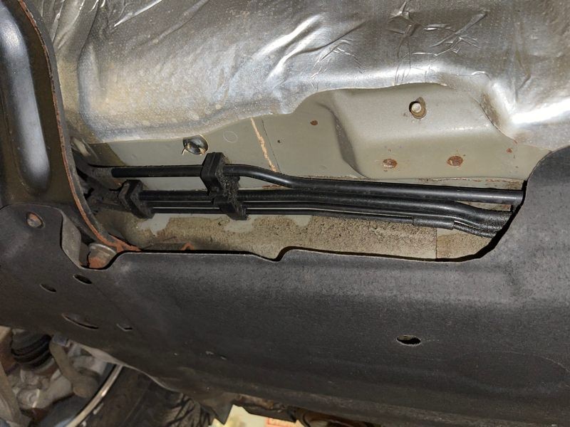 Fuel line under vehicle carriage