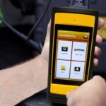 Technician using Diesel Handheld Pro on a truck