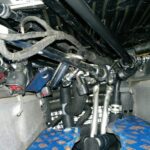Limited access to PCV valves in an Aston Martin DB9, highlighting the difficulty of manual replacement