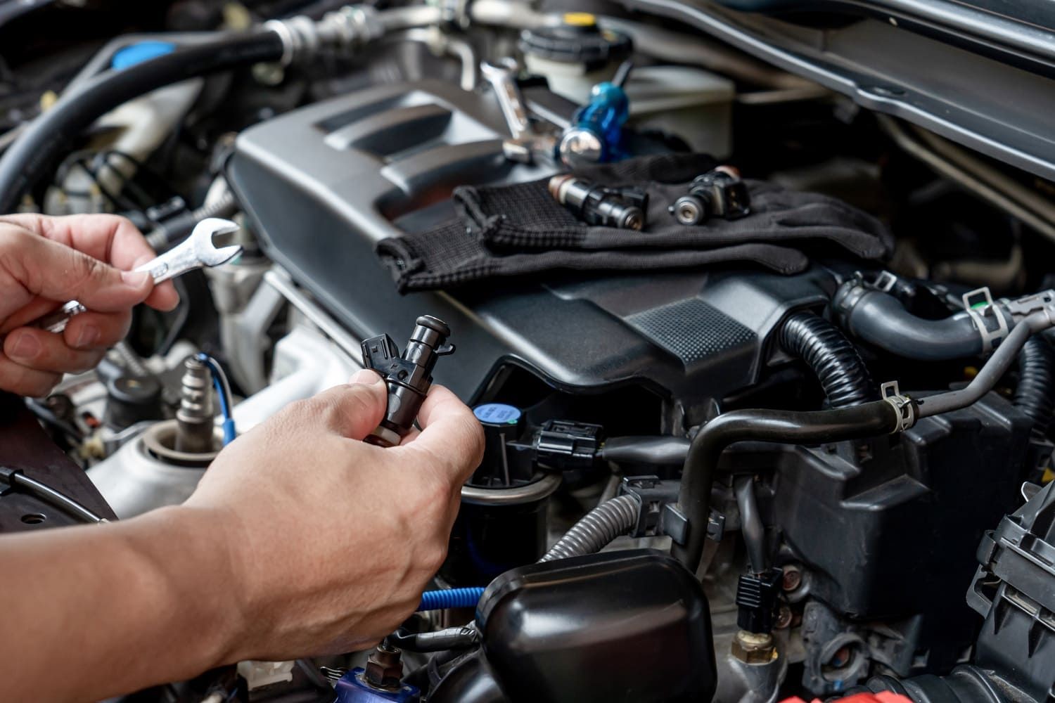 Mechanic Changing a Fuel Injector