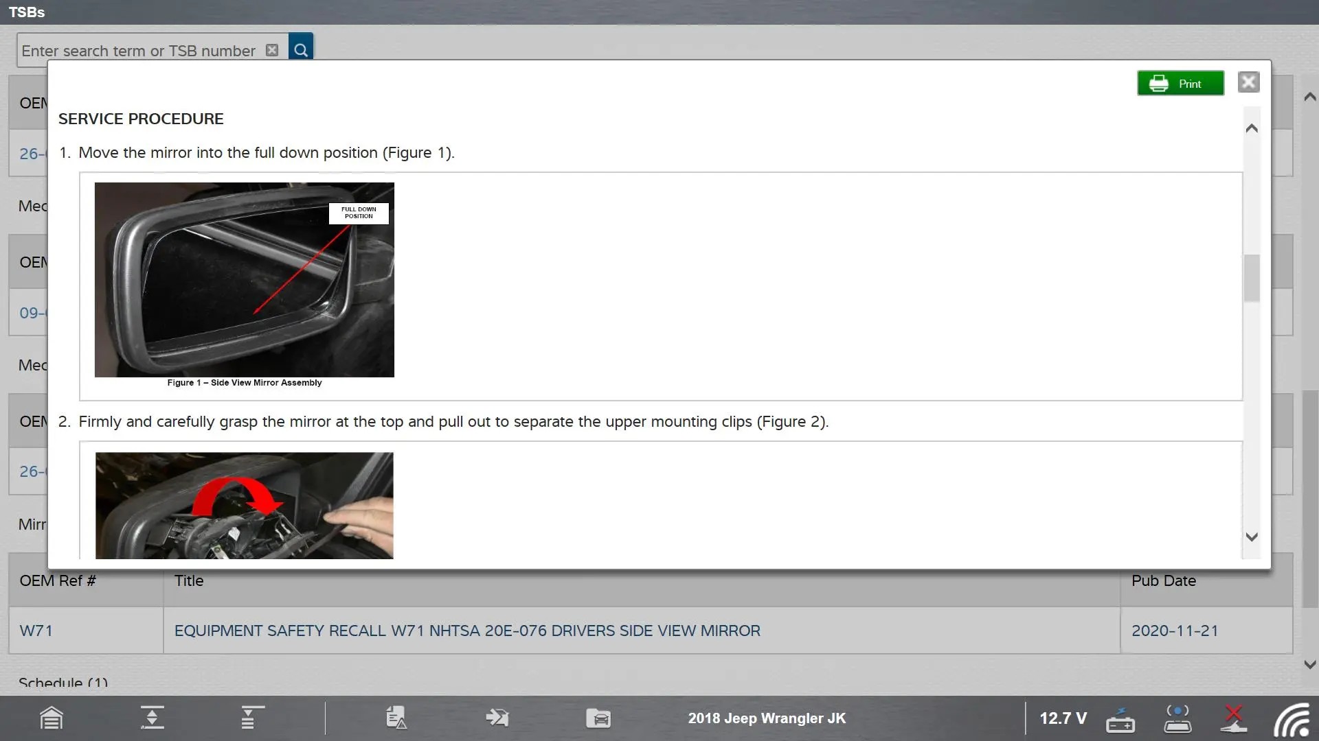 Technician reviewing TSB information on a diagnostic tool