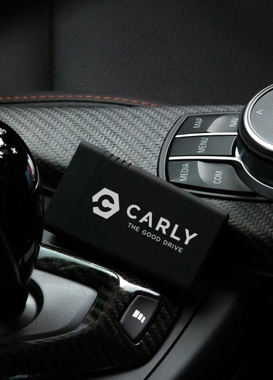 Carly connector positioned next to gear lever in a car