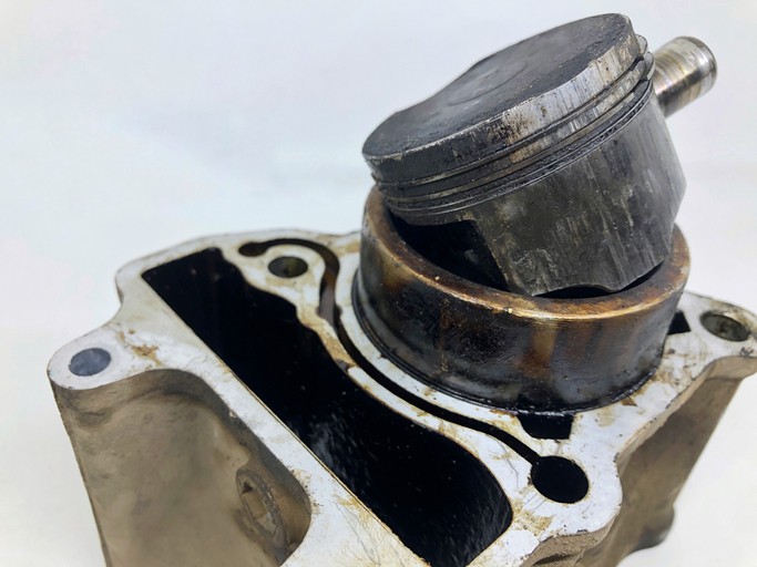 Damaged head gasket due to overheating.