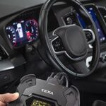 Tech diagnosing car
