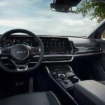 Kia dashboard with infotainment system showing vehicle settings